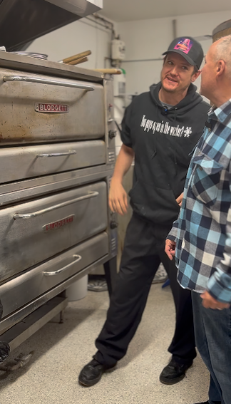 John working the pizza oven