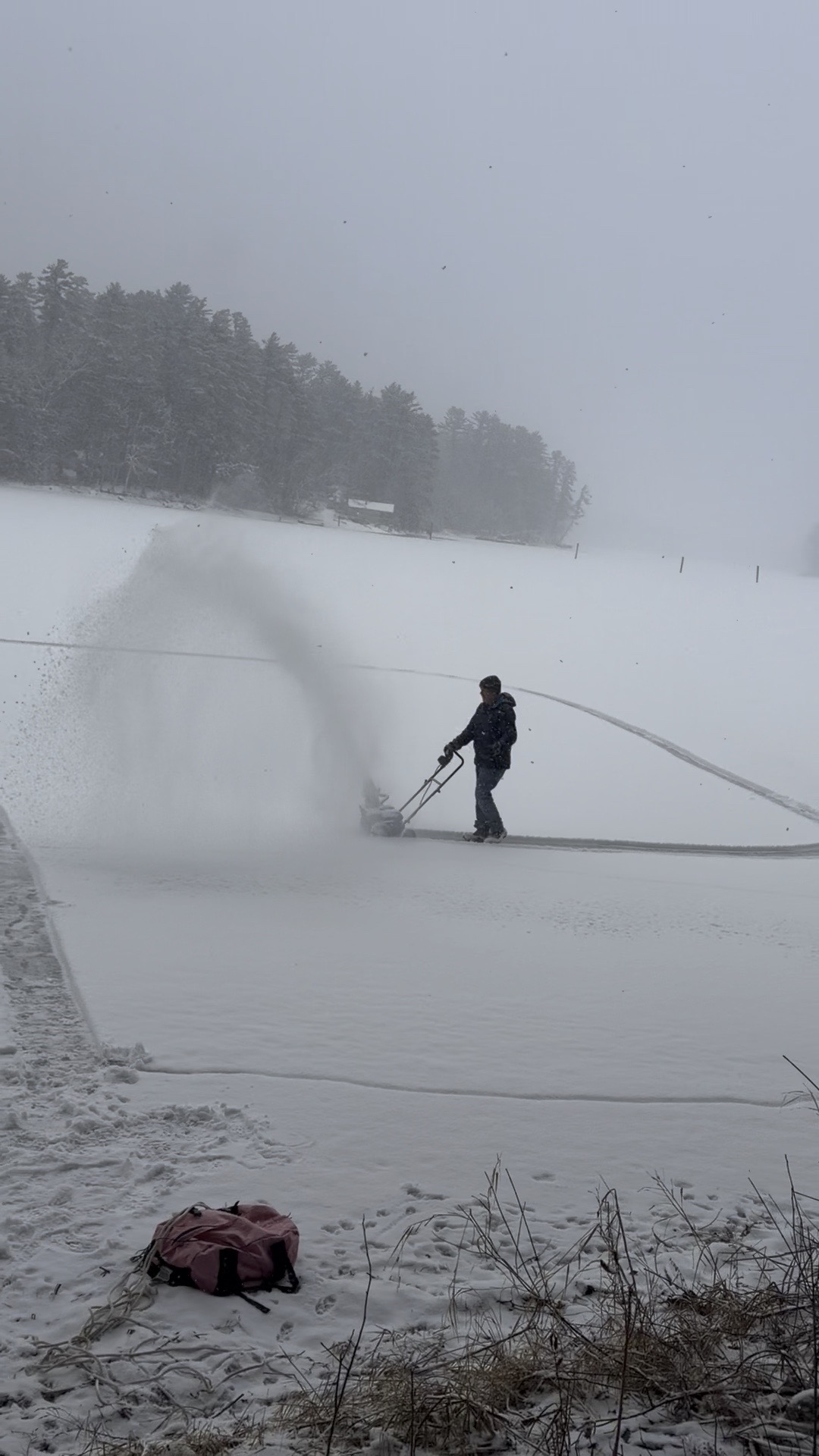 Clearing snow on the frozen lake